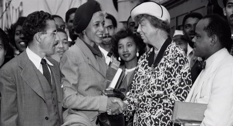 Eleanor Roosevelt shakes hands