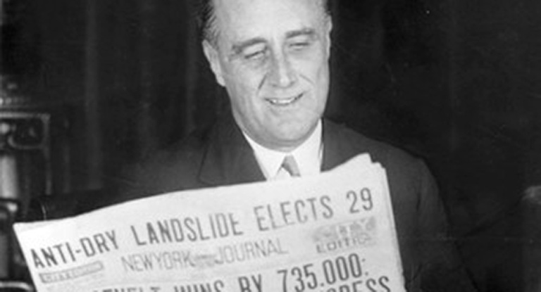 Governor Franklin Delano Roosevelt reads a newspaper