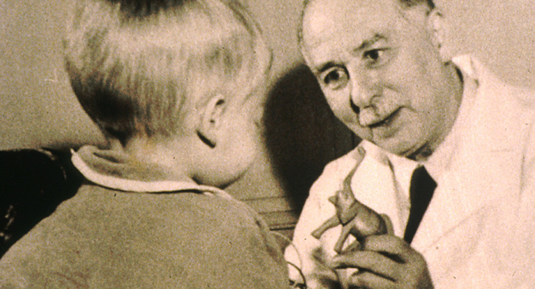Sidney Farber, M.D., with a young patient.