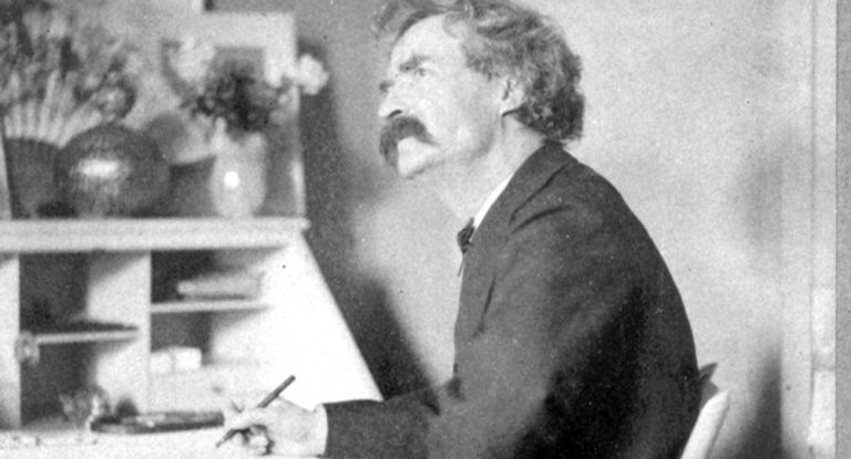 Mark Twain at his desk, 1884