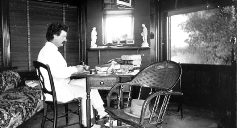 Mark Twain at his writing desk in his study at Quarry Farm in Elmira, New York, 1874