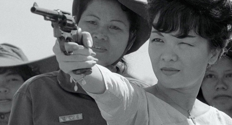 Madame Nhu fires a gun