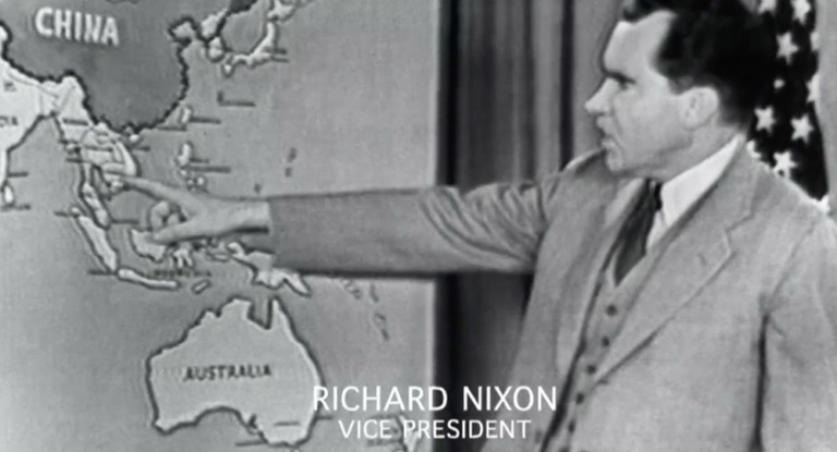 Richard Nixon points at a map