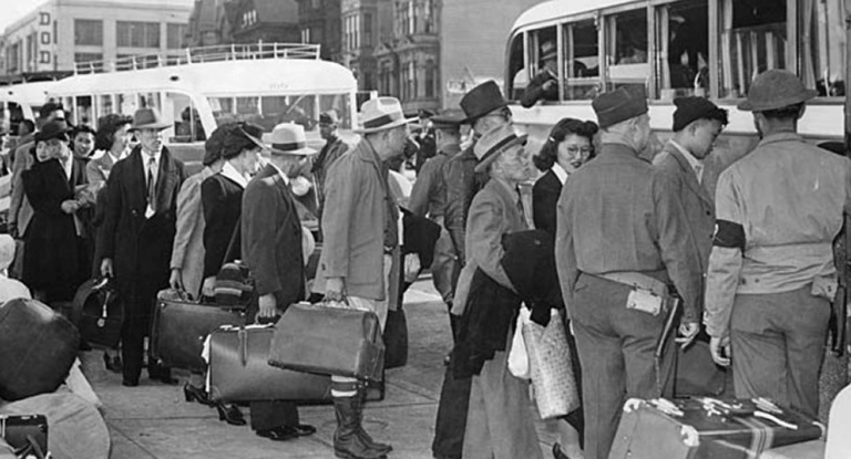 Japanese-American evacuees board a bus in San Francisco