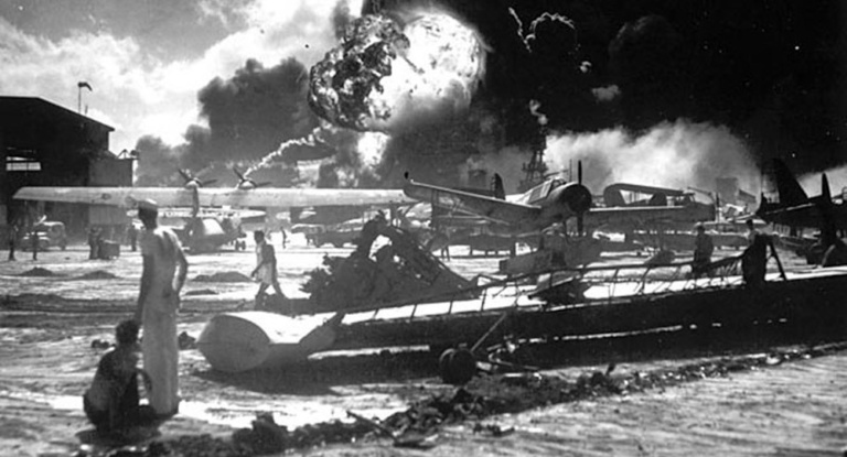 The USS Shaw explodes after being hit by the Japanese during the attack on Pearl Harbor